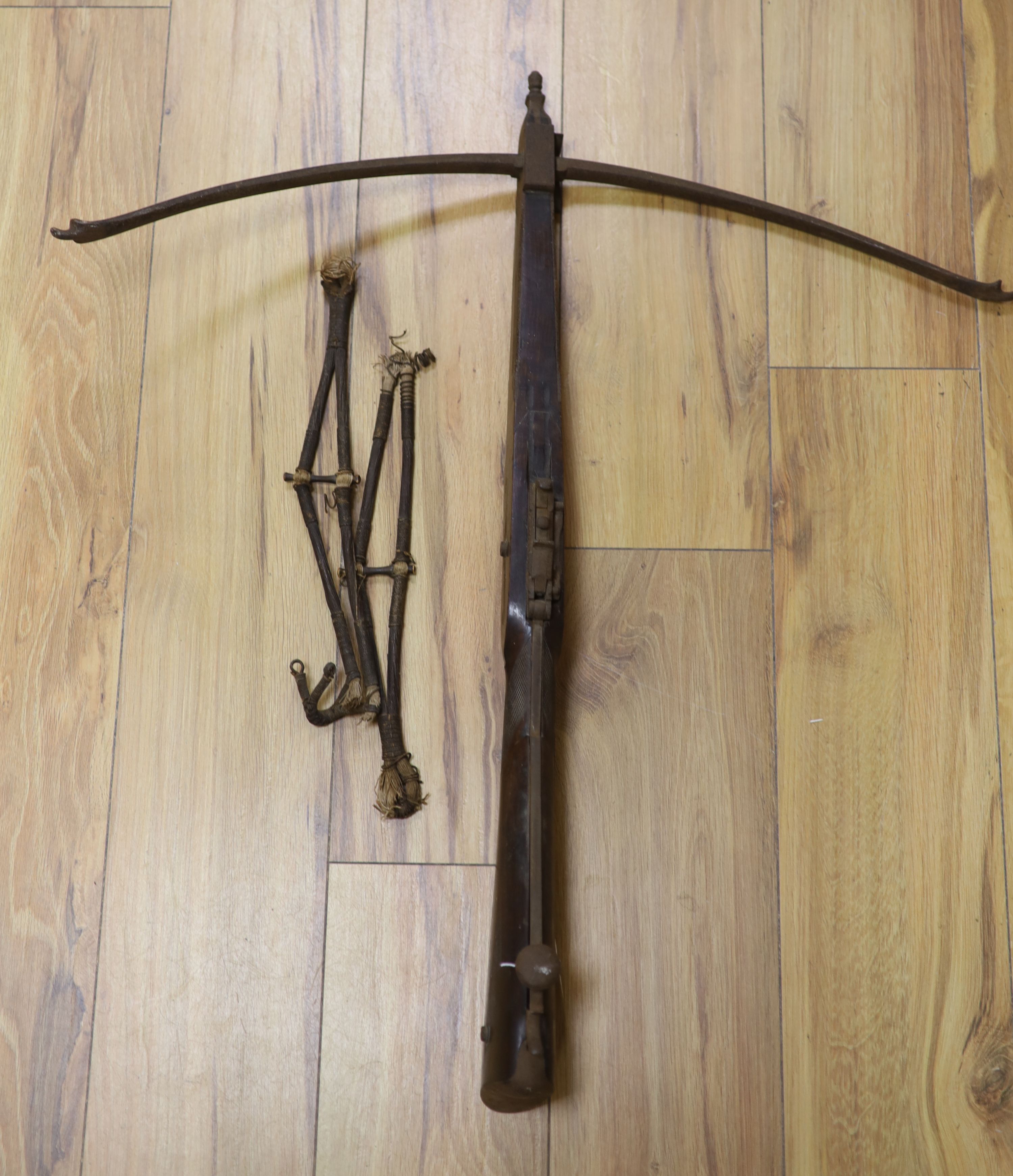 A 19th century steel and walnut crossbow